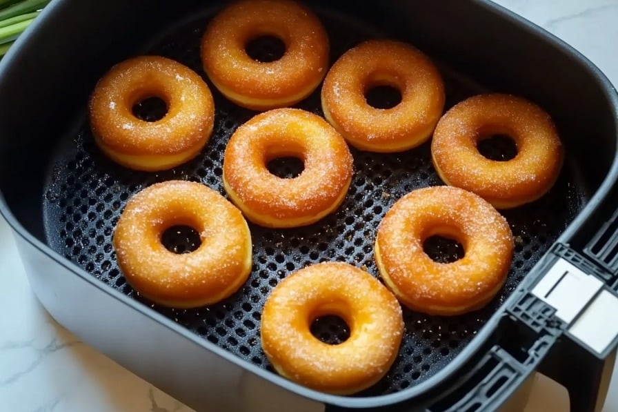 3-Ingredient Keto Air Fryer Donuts (Ready in 5 Minutes!) 8 Keto donuts cooking in air fryer