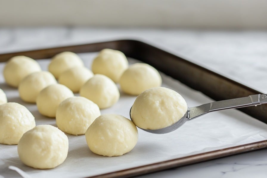 3-Ingredient Keto Donut Holes: Air Fryer Bite-Sized Magic 8 shaping keto air fryer donut holes with scoop
